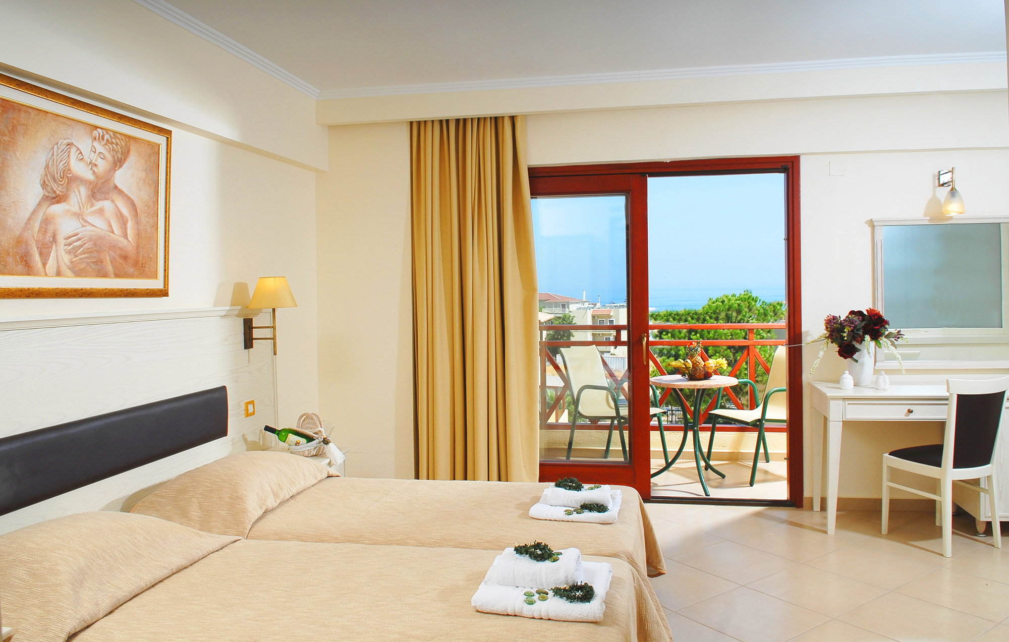 Cactus village hotel room with two single beds and balcony overlooking the sea
