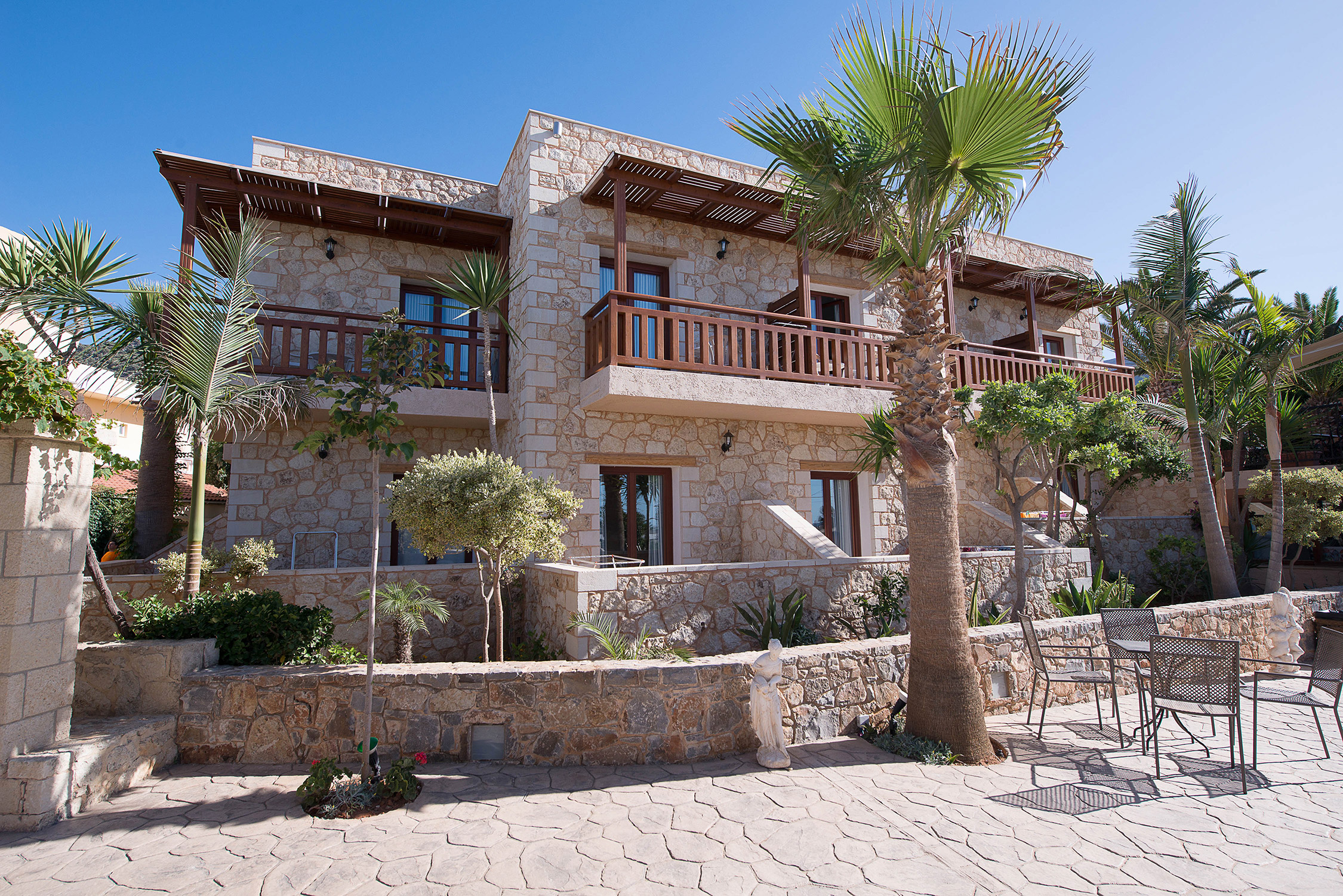Exterior view of stone hotel rooms Cactus village